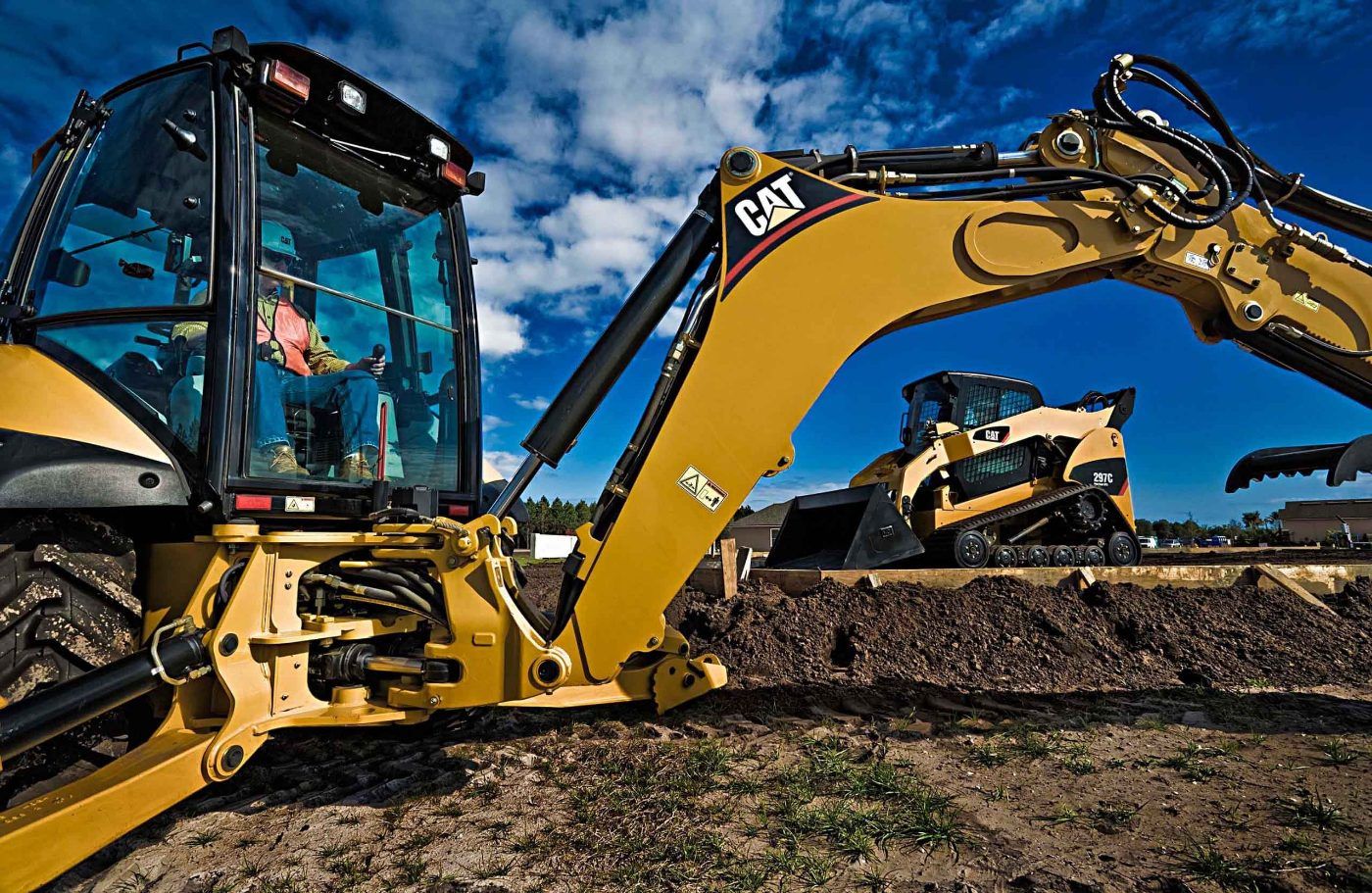 Premier Groundworks excavating equipment on a job